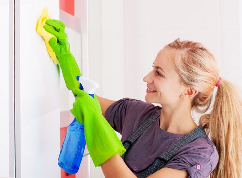 Carpet cleaner preparing equipment in a safe cleaning environment
