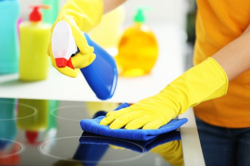 Technician checking cleaning tools and hazard controls before work